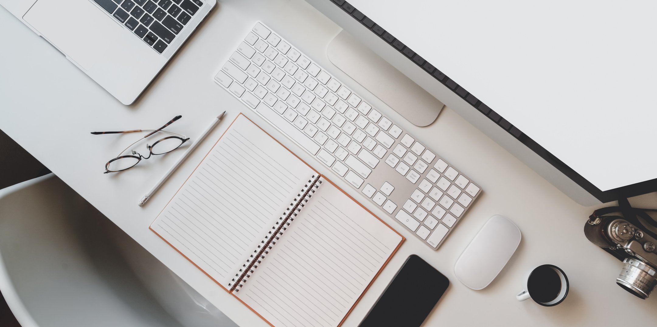 Desk with modern computer and stationery