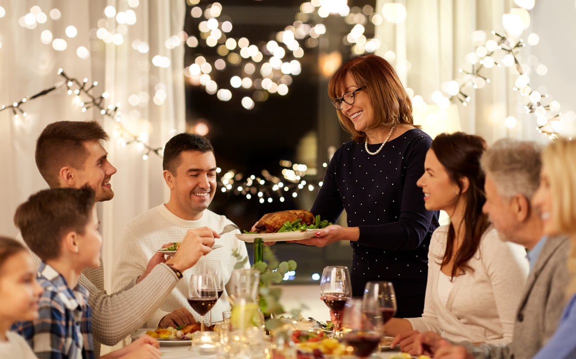 Happy Family Having Thanksgiving Dinner at Home